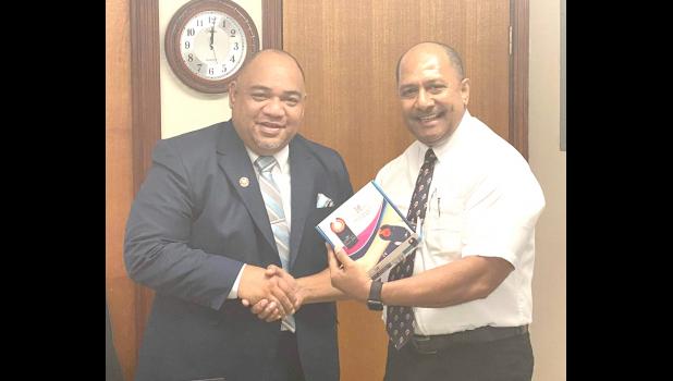 Faipule Tapai Ala’ilepule Benjamin Vaivao hands over devices