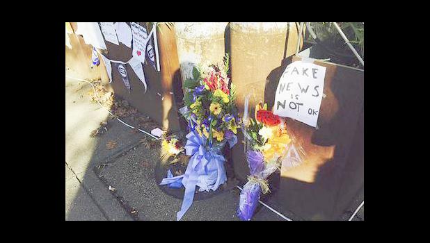 - In this Friday Dec. 9, 2016 file photo, flowers and notes left by well-wishers are displayed outside Comet Ping Pong, the pizza restaurant in Washington. There's at least a slice of good news for a pizza restaurant in the nation's capital that has been the target of fake news stories linking it to a child sex trafficking ring. In almost a week since an armed man arrived at Comet Ping Pong to investigate the conspiracy, neighbors and patrons have responded by bringing homemade signs, flowers and their pizza-purchasing power to the store. (AP Photo/Jessica Gresko) - In this Friday Dec. 9, 2016 file photo, flowers and notes left by well-wishers are displayed outside Comet Ping Pong, the pizza restaurant in Washington. There's at least a slice of good news for a pizza restaurant in the nation's capital that has been the target of fake news stories linking it to a child sex trafficking ring. In almost a week since an armed man arrived at Comet Ping Pong to investigate the conspiracy, neighbors and patrons have responded by bringing homemade signs, flowers and their pizz