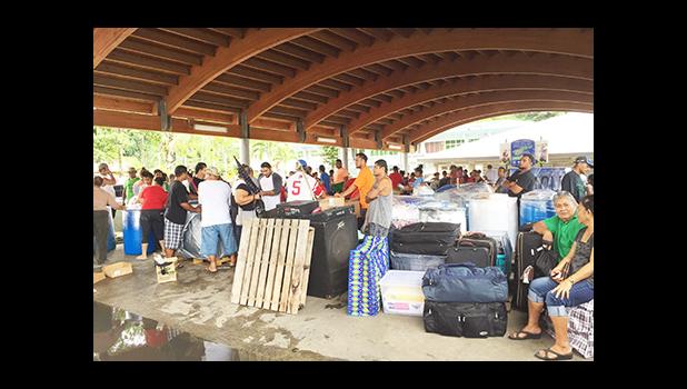 Some of the STP workers who have been laid off, packing all their belongings and things first to take to Samoa. Tickets for the ferry Lady Naomi were sold out, but Polynesian Shipping made it possible for the STP  and StarKist Samoa workers to have first priority to leave on Thursday.  [Photo: Ese Malala]