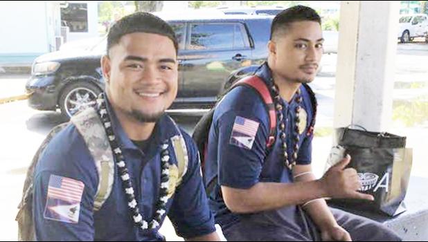 Two young men at bus stop