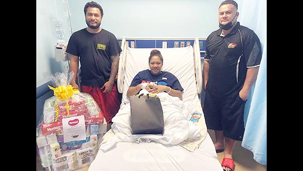 Her mother, Faaleava Mack of Aasu is seen recovering with a gift pak for the newborn from Pacific Independent Distributors (PID) and Kimberly-Clark Faaleava Mack of Aasu receiving gifts