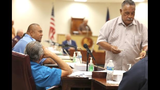 Faipule Suʻa Alex Jennings from the back being bypassed by house clerk