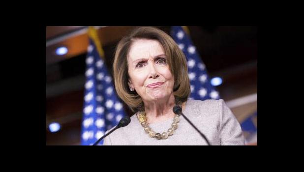 In this Feb. 16, 2017, file photo, House Minority Leader Nancy Pelosi of Calif. listens during a news conference on Capitol Hill in Washington. The AP reported on July 14, 2017, that a series of stories circulating online regarding a drug bust involving Pelosi's daughters is a hoax. (AP Photo/J. Scott Applewhite, File)