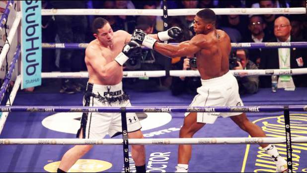 CARDIFF, WALES - MARCH 31: Anthony Joshua and Joseph Parker exchange punches during there WBA, IBF, WBO & IBO Heavyweight Championship title fight at Principality Stadium on March 31, 2018 [photo via NZ Herald]