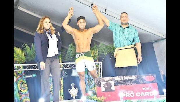 Local bodybuilder Frank Asi Tuisalega receives his trophy