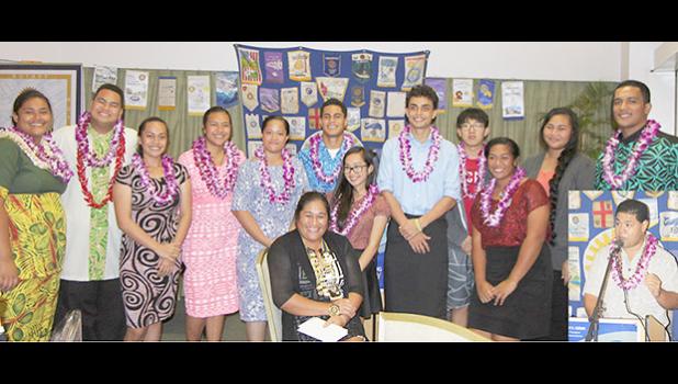 Students, who are the recipients of the 2017 Rotary Club of Pago Pago 4-Way Test, with President Margie Tafiti seated, and inset Representative Samuel Meleisea. [Courtesy photo]