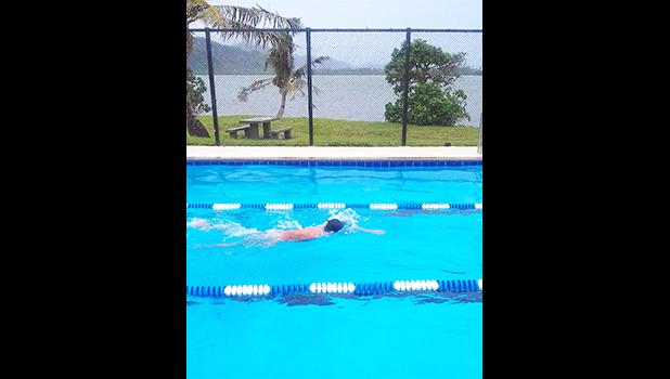 PHS high school student works to perfect his freestyle stroke.