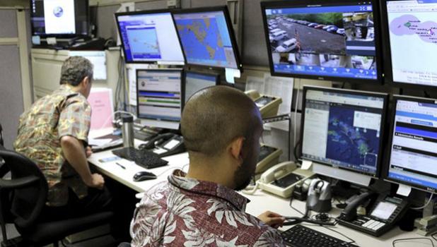 In this Dec. 1, 2017 file photo, Hawaii Emergency Management Agency officials work at the department’s command center in Honolulu. A Hawaii employee who mistakenly sent an alert warning of an incoming ballistic missile earlier this month, creating a panic across the state, thought an actual attack was imminent, the Federal Communications Commission said Tuesday, Jan. 30, 2018. (AP Photo/Caleb Jones, File) In this Dec. 1, 2017 file photo, Hawaii Emergency Management Agency officials work at the department’s command center in Honolulu. A Hawaii employee who mistakenly sent an alert warning of an incoming ballistic missile earlier this month, creating a panic across the state, thought an actual attack was imminent, the Federal Communications Commission said Tuesday, Jan. 30, 2018. (AP Photo/Caleb Jones, File)