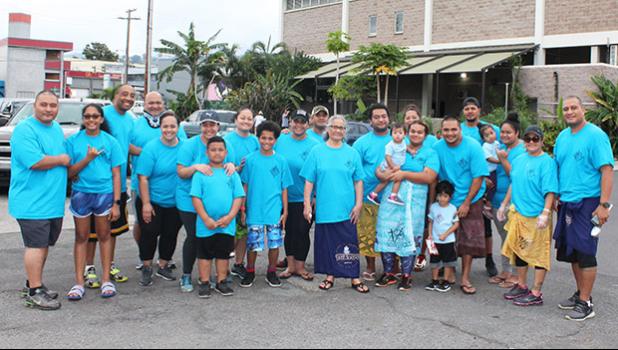 Pictured are church members in front of one of the few homeless shelters around Kakaako that houses women and children. The congregation recently paid a visit to the shelter, where members served food and drinks to the residents.  [courtesy photo]