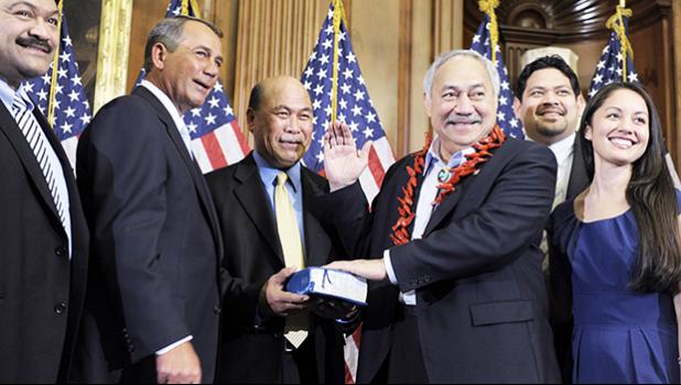 In this Jan. 5, 2011 file photo, House Speaker John Boehner, second left, of Ohio participates in a ceremonial House swearing-in ceremony for Del. Eni H. Faleomavaega, third from right, D-American Samoa, on Capitol Hill in Washington. American Samoa’s longest serving non-voting delegate to the U.S House of Representatives Faleomavaega died Wednesday, Feb. 22, 2017, at age 73. [AP Photo/Susan Walsh, File]