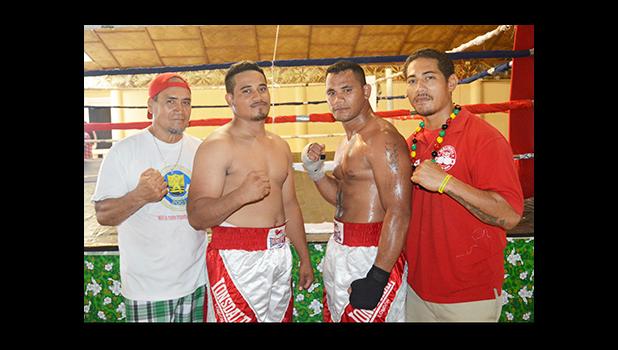 Two professional fighters from American Samoa — Paofe Seeti (second from left) and Ofisa Talaimalo (third from left) with their coach and trainer, Sala Sanele Etuale (left). [photo by AF]