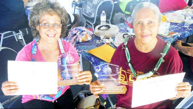 ASCC Business Department chairperson Mrs. Faofua Faatoafe (left) and College Accelerated Preparatory Program (CAPP) English chairperson Mrs. Elisapeta Faalafi-Jones are seen here with their awards received during the College's Faculty Achievement Awards Ceremony last week.  [Photo: J. Kneubuhl] 