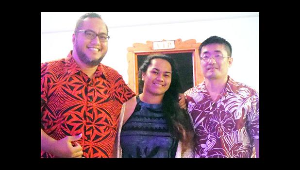 At last week's Graduate Banquet, ASCC fall 2016 graduate Ms. Alisi Tiffany Tagaloa (center) receives a Health & Human Services Department award from faculty members Dr. Daniel Chang (right) and Mr. Derek Helsham.  [Photo: J. Kneubuhl]