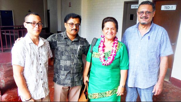 Following her guest speech at an ASCC faculty conovocation, DOE Director Dr. Ruth Matagi-Tofiga (second right) took a moment to chat with (l-r) student Ulelemaikalani Nate Kwon, science instructor Gopalan Murali and automotive instructor Fred Suisala.  [Photo: J. Kneubuhl]