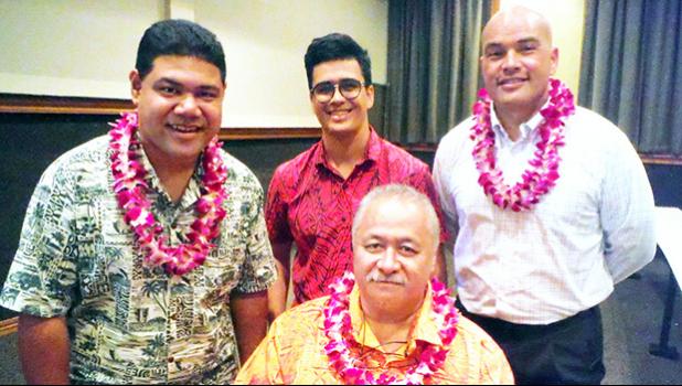 ASCC Political Science Club president George Young (standing, center) congratulates the presenters at the Political Status Forum held at the college last week. They are (l-r) House Rep. Samuel Meleisea, Dr. Dan Aga, Director of the ASG Office of Political Status (seated), and ASCC Executive Counsel Mr. Kenneth Kuaea.  [Photo: J. Kneubuhl]