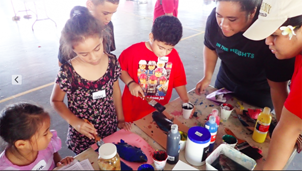 ASCC Marine Science student interns Claudia Thompson and Naomi Matagi teach local youth about fish anatomy and ecology through fish prints at the recent STEM Summit at Samoana High School.  [Courtesy Photo]