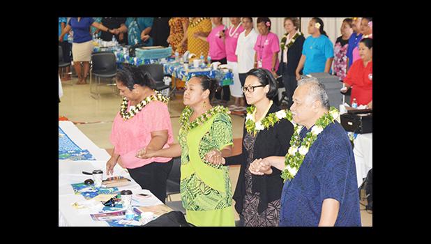 A look at some of the members of the American Samoa delegation as they joined hands and sang “Lota Nu’u”, during the closing ceremony at last Friday’s 7th Bilateral Health Summit of the two Samoas at Gov. H. Rex Lee Auditorium.  [photo: AF]
