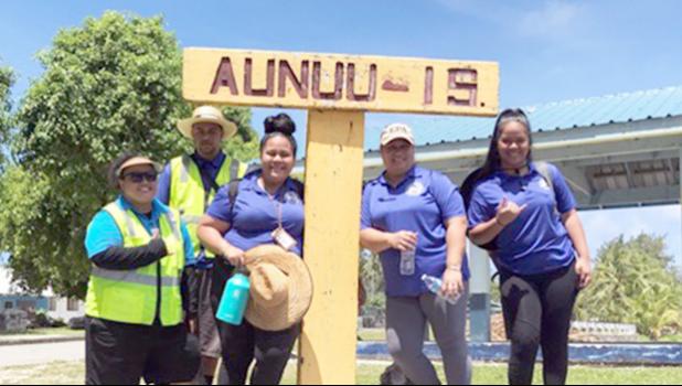Three ASPA workers on a return boat ride last Friday from Aunu’u to Auasi.  [photo: Leua Aiono Frost]