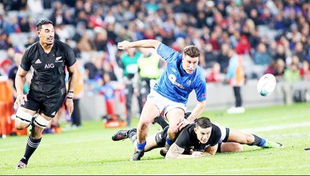American Samoa's own Jerome Kaino, Sonny Bill Williams are unable to secure the ball due to ferocious Manu Samoa aggressive defense.  The New Zealand All Blacks defeated Manu Samoa 15s 78-0 at Eden Park, Auckland, New Zealand.   [Photo: Barry Markowitz]