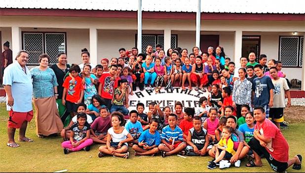 Amata with students at A.P. Lutali Elementary School.  [Courtesy photo]