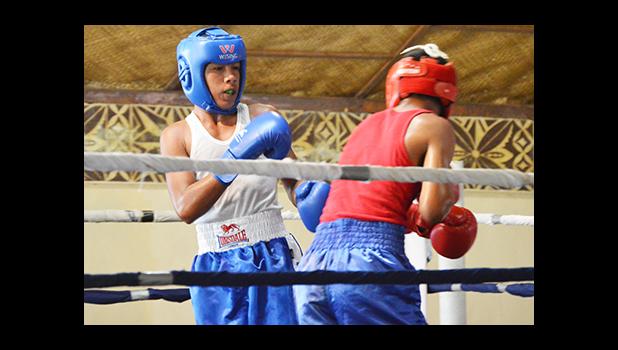 Karl Apelu (left) of Samoa against Mamona Tafa (right) of American Samoa during the first bout of the 2016 Mosooi International Boxing Championships last Saturday night at the Maliu Mai Resort in Fogagogo. Apelu won his bout in a unanimous decision. [photo by AF]