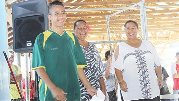 Austin Kaleopa, left, of Utulei Youth receives his 2017 FFAS Futsal Tournament’s championship game MVP award from FFAS executive member Amio Mavaega-Luvu (middle) and FFAS Vice-President and FIFA Council member Sandra Fruean (right), on Monday, May 29 at the Samoana High School gymnasium in Utulei.  [FFAS MEDIA/Brian Vitolio] 