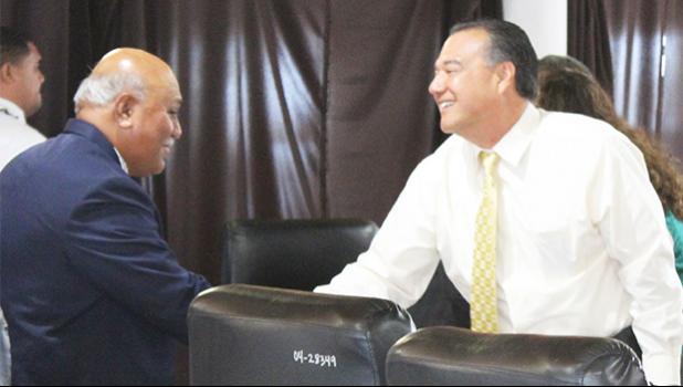 President/CEO of Haleck Enterprises Inc., Avamua Dave Haleck (right) shaking hands with Sen. Fa’amausili Mau Mau Jr., after testifying last Thursday before a Senate committee on three administration revenue measures.  [photo: FS]
