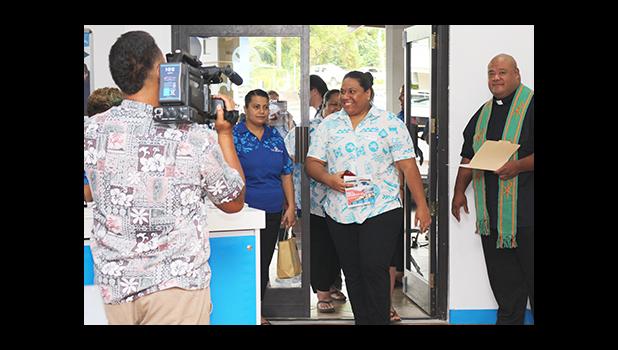 Huge smiles on the faces of Bluesky Communications employees as they were officially welcomed into their newly renovated store – which re-opened yesterday morning at the Laufou Shopping Center. [photo: TG]