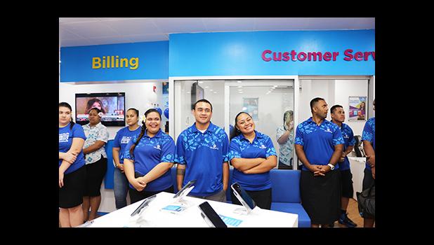 Bluesky Communication employees awaiting the end of the dedication ceremony to officially open their newly renovated store inside the Laufou Shopping Center yesterday morning. [photo: TG]