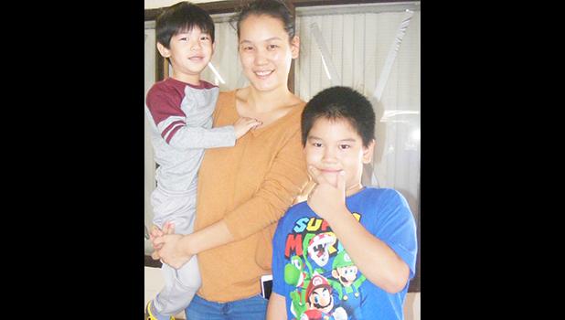 Susie Cheng and her two children, at the Pago Pago International Airport on Sunday morning, were among the first nine-passengers on Talofa Airways’ inaugural flight from American Samoa to Nuku’alofa, Tonga on Sunday, July 2.  [photo: FS]