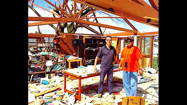 Paul Bayly (l) surveying the damage done by TC Winston with ​DS at RKS school library in Viti Levu, with one of his deputies Puamao Sowane (r).  [Courtesy photo]