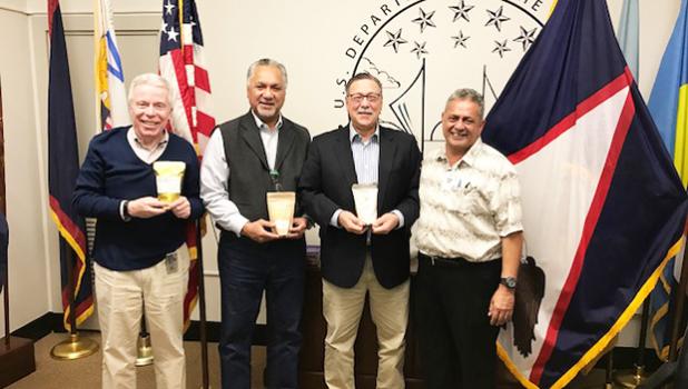 [l-r] US Interior Department staff assistant Joseph McDermott; DOI Office of Insular Affairs director Nikolao Pulal; Interior Assistant Secretary for Insular Areas, Douglas Domenech; and American Samoa House Agriculture Committee chairman Rep. Su’a Alexander Eli Jennings at the DOI office in Washington D.C. on Nov. 17 where Su’a update DOI officials of the breadfruit development initiative in the territory. The DOI officials are holding packages of gluten free breadfruit flour, manufactured in the territory