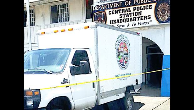 The DPS Main Central Station in Fagatogo was sealed off with yellow tape and guarded by armed cops yesterday morning, after a fire broke out on the second floor of the building, in the area where the CID unit is housed. Samoa News was unable to confirm why the DOE school lunch truck (pictured) was at the site. [photo: BC]