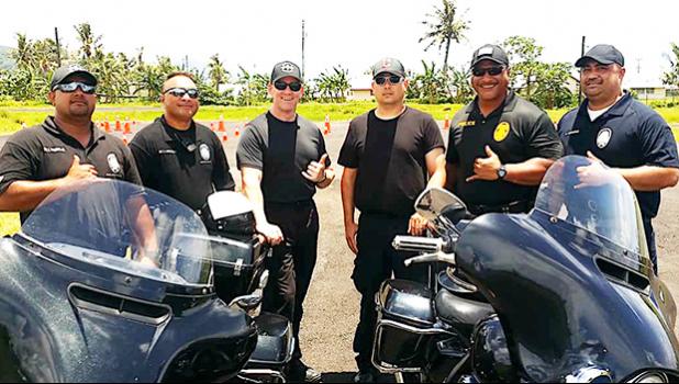 Four Department of Public Safety officers who completed and passed the Police Motorcycle Instructor Final earlier this year. The training was overseen by two Arizona State Troopers (pictured, center) who were part of a delegation that arrived earlier this month to conduct DUI courses for over 30 local cops. The police motorcycle instructor course was an add-on to the ARIDE training course and resulted in the off island instructors staying a week longer. [SN file photo]