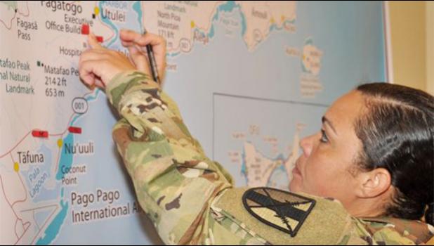 Chief Warrant Officer Sara Matos, assigned to the 303rd Maneuver Enhancement Brigade, 9th MSC, labels a map with critical locations during Ocean Sun EDRE in American Samoa, 14-18 Aug. (Photo by Capt. Liana Kim) Chief Warrant Officer Sara Matos, assigned to the 303rd Maneuver Enhancement Brigade, 9th MSC, labels a map with critical locations during Ocean Sun EDRE in American Samoa, 14-18 Aug. (Photo by Capt. Liana Kim)