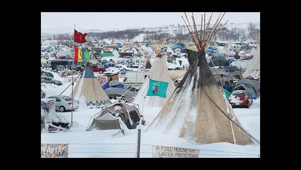 ioux-Oglala Latoka Tongan artist Juliana Brown Eyes-Clifford Kaho says protesters young and old have been sprayed with water cannons in temperatures which are below freezing. [Photo: AFP/ GETTY IMAGES NORTH AMERICA / Scott Olson via RNZI] 