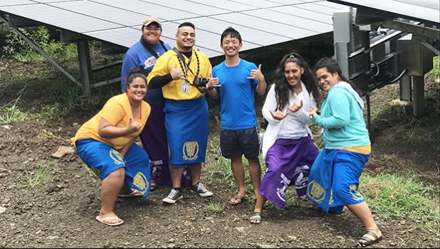 Senior Policy Specialist for the Pacific Resources for Education and Learning (PREL) in Honolulu, HI Daniel Lin (center) is surrounded by five “storytellers” from Manu’a High School, who submitted stories and photographs as part of the Pacific Storytellers Cooperative last week.  [photo: courtesy]