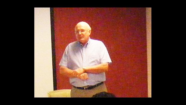 In this 2012 file photo, then-Chamber of Commerce chairman David Robinson addressed about 20 members of the private sector at a presentation on economic development. [SN file photo]