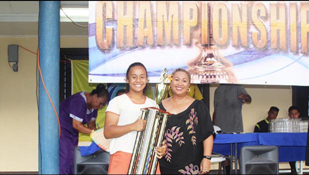 Fa’asao-Marist Cougars’ Jordynn Liu-kuey accepts the ASHSAA Girls J-V championship trophy from FFAS Vice-President, and Head of Women’s Soccer, Sandra Fruean, at Pago Park Soccer Stadium on Wednesday, March 22, 2017.  [FFAS MEDIA/Brian Vitolio]