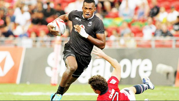 Fiji powers on 40-0 vs Hong Kong in the Singapore Sevens, Day 1, National Stadium, Singapore.   [Photo: Barry Markowitz]