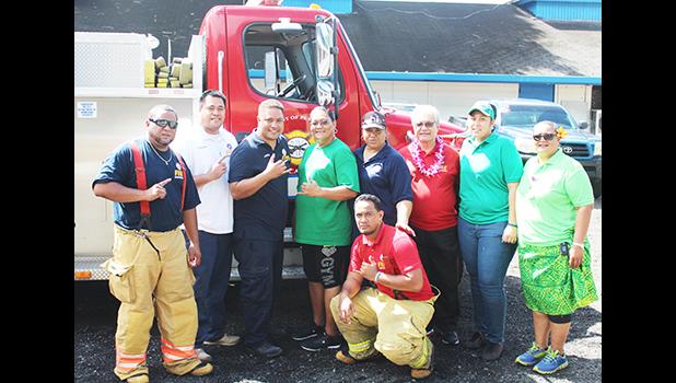 Fire Chief O'Brien and his crew, along with officials from the School Lunch Program, following a presentation by the Fire Dept. last Thursday during the week-long food safety training workshop for all SLP cooks and food handlers. See story for full details.   [Courtesy photo]