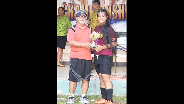 Frieda Vaaimamao, right, of the Tafuna Warriors receives her ASHSAA Girls J-V MVP award DOE’s Liatama Amisone Sr. on Wednesday, March 14, 2018 at Pago Park Soccer Stadium.  [FFAS MEDIA/Brian Vitolio] 