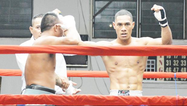 George Tanoa Jr. of American Samoa (right) raising his hand after winning his first professional fight — that was against veteran Tony Iapesa of Samoa in the heavyweight division during the American Samoa Flag Day 2017 Championship Boxing event for the All Samoan Light Heavyweight Title between the two Samoas last Saturday night at the old Bowling Alley in Tafuna [photo: AF]