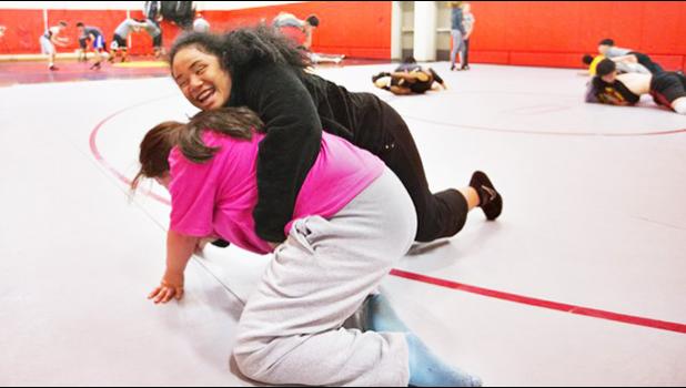 Goddess Ma’alona-Faletogo, a 14 –year-old Samoan girl — who was born blind — made it to Washington State Wrestling Championship this past weekend. She is seen here in wrestling practice. Her advice to American Samoa’s kids: “Remember to put God first in all that you do and He will do the rest.” See story below. [Courtesy photo]