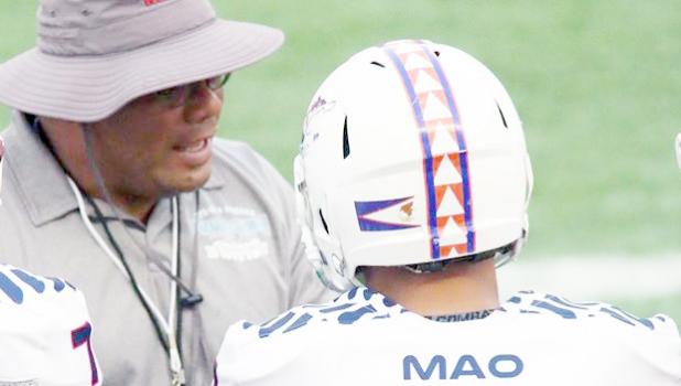American Samoa All-Star Head Coach, Pati Pati – encouraging Adan Mao and our defensive unit during their match up against Hawaii West, their final game of the classic that was held last week at Aloha Stadium in Hawaii.  [photo: Dann Ebina]