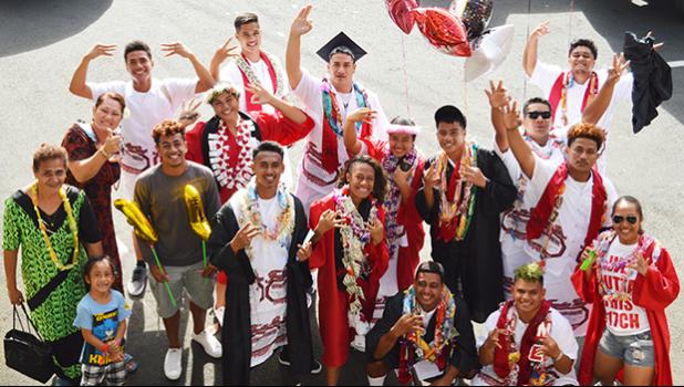 Graduates of Faga’itua HS happily posed for the Samoa News camera following graduation luncheons and gatherings being hosted around the island to celebrate their successful completion of 12 years of education with families and friends.  [Photo:THA]