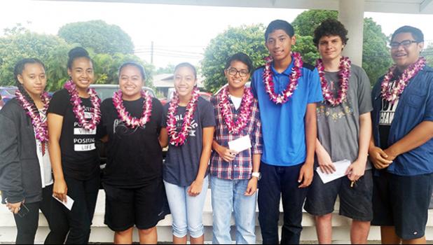 High school students from the Home of the Flames last week participated in the Territorial Science Fair competition. First place category winners are: Aitulagi Alofa (far left), Dorvida Fuiava (2nd from left), and Brodie Blizzard  (2nd from right).  [Photo: Blue Chen-Fruean]