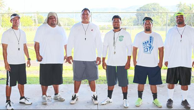 Lions coaching staff led by Head Coach Okland Salave'a (center) posing for a group photo just before practice in August 2016. [SN file photo]