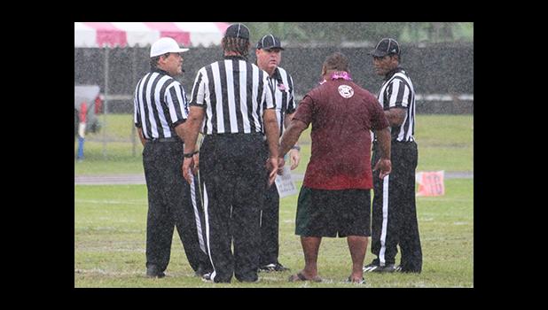 A frustrated Kolose Ili, the Warriors Head Coach arguing with the official on a call – Nu’uuli’s fourth down which resulted in a fumble, giving the Wildcats the fortunate first down conversion that allowed them the opening touchdown of the game, late in the first quarter of play. [photo: TG]
