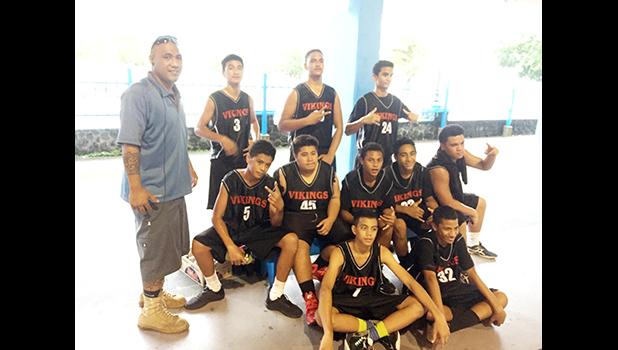 Coach Afati Afati with the Fagaitua Vikings JV Basketball team after losing against the Samoana Sharks JV on Tuesday evening.  [photo: Ese Malala]